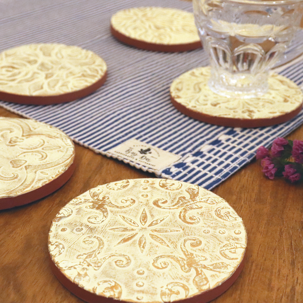 Table Tales Collection: Embossed Round Clay Coaster Set